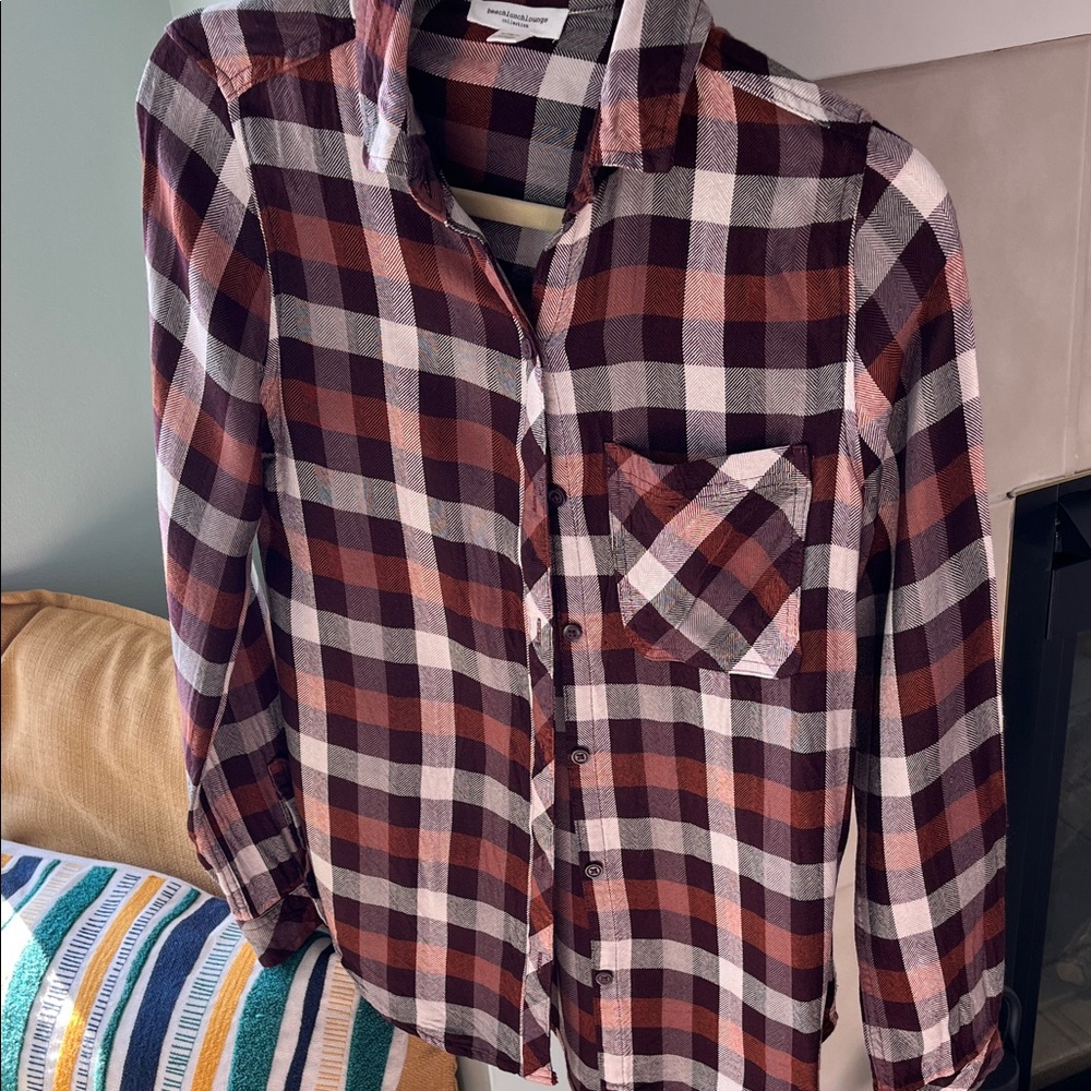 Plaid long sleeve button down front. Buy one item, second item is free
